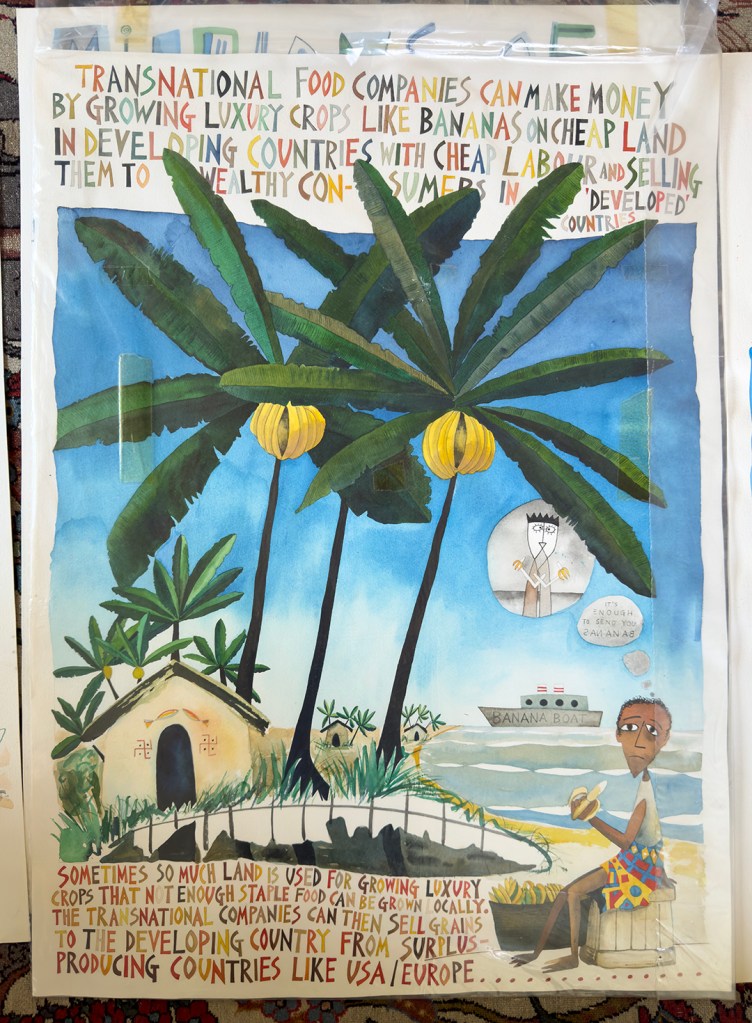 A poster featuring a man sitting on a box eating a banana under trees growing bananas and a hut, and a ship in the distance. Text is above and below the image.